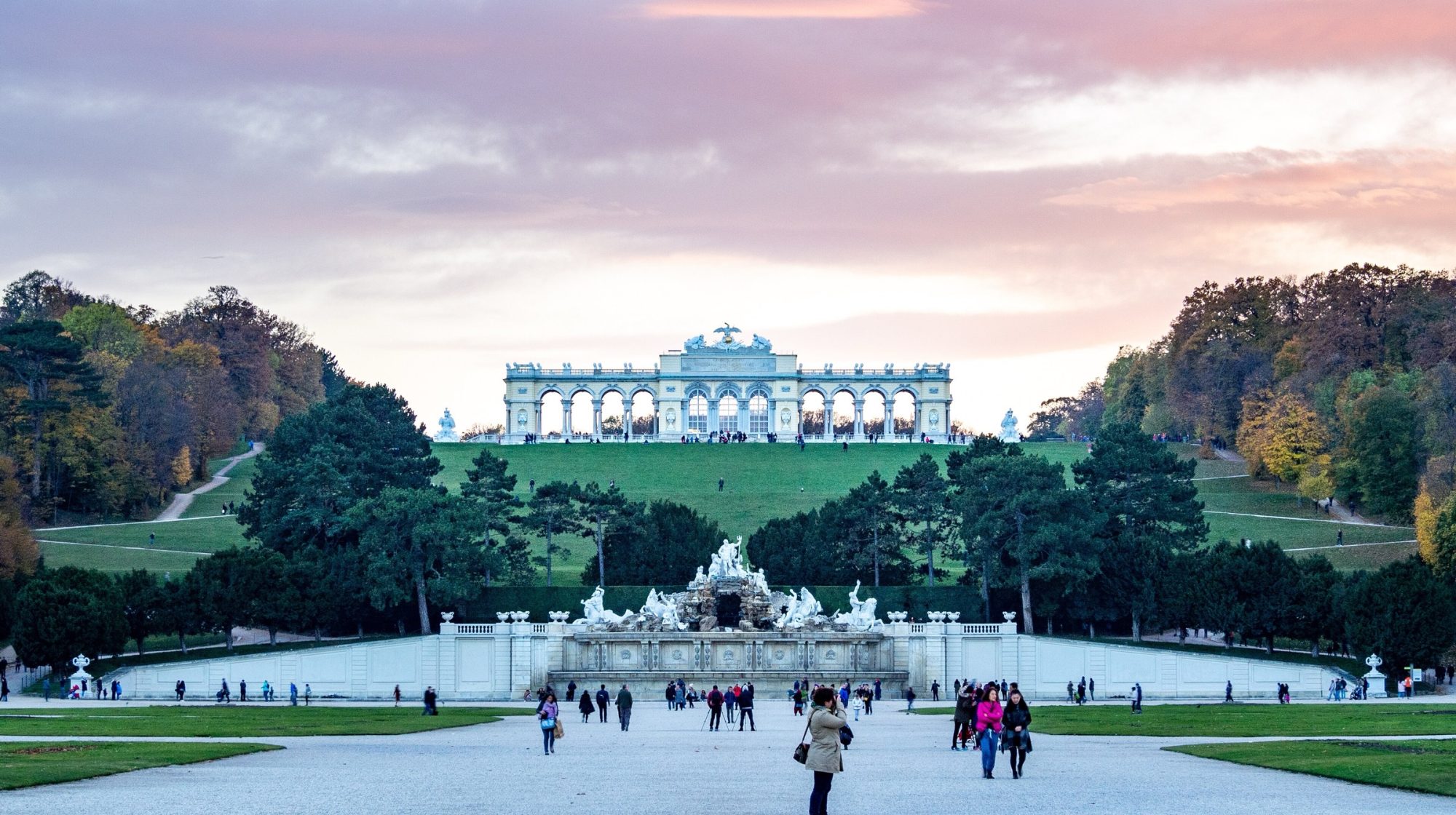 The Gloriette on the hill above Schönbrunn's Neptune Fountain at sunset