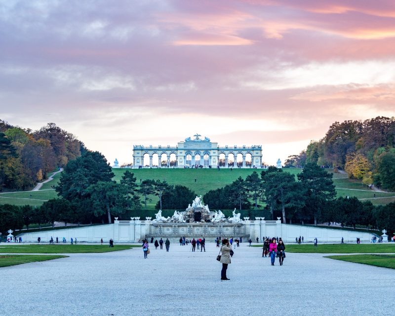 The Gloriette on the hill above Schönbrunn's Neptune Fountain at sunset