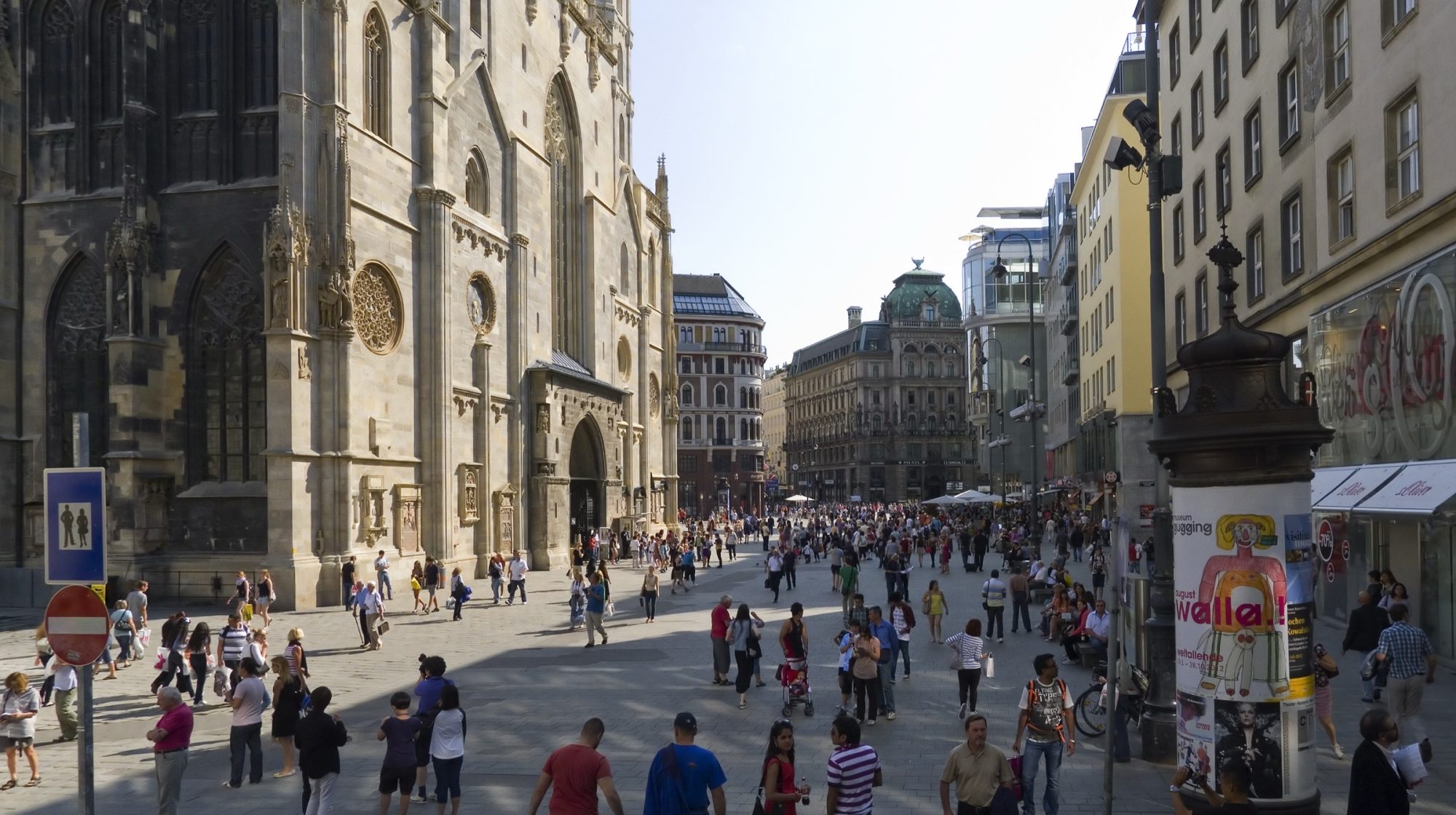 St Stephen's Cathedral rising over a busy Stephansplatz, with visitors crossing the square