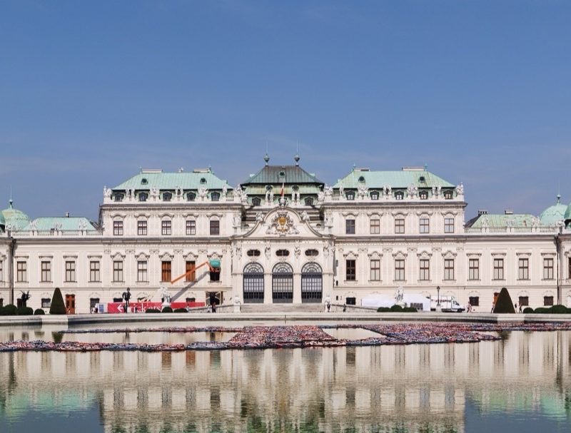 The Upper Belvedere mirrored in the long reflecting pool of its garden