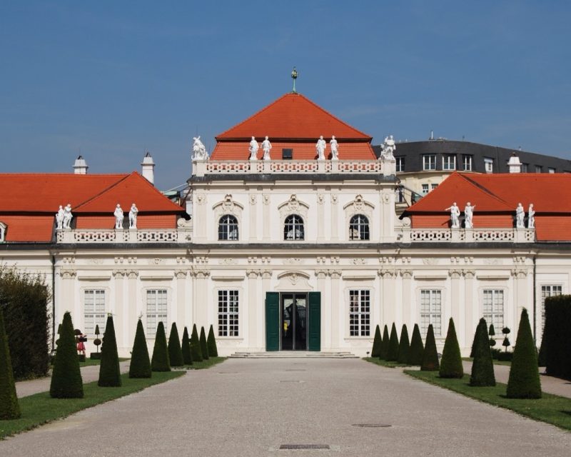The Lower Belvedere's garden front, flanked by conical clipped yews